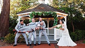 Bride Pulling Groom from the Groomsmen